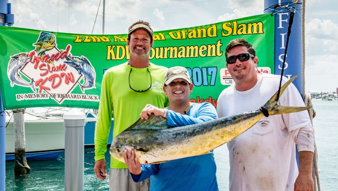 The 22nd annual Grand Slam KDW's second place winners - for this 15.1-pound Mahi -  are teammates Kenny Hinkle Jr., Ann Cruz and Mike Burkhart.