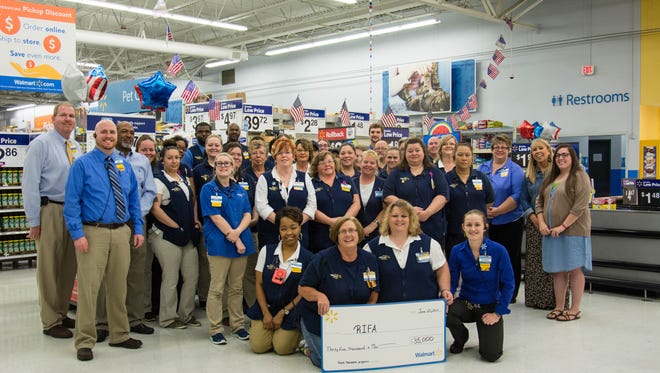 The Regional Inter-Faith Association of Jackson celebrated a $35,000 Walmart Foundation grant for the Snack Back program to provide food to schoolchildren who have little or no food over the weekends.