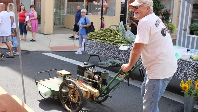 Dan Diedrich, the lucky winner of the mower parade, ended up marching solo after being the only entrant, but it was a blast nonetheless at the Farmer's Market in downtown Fremont on Saturday.