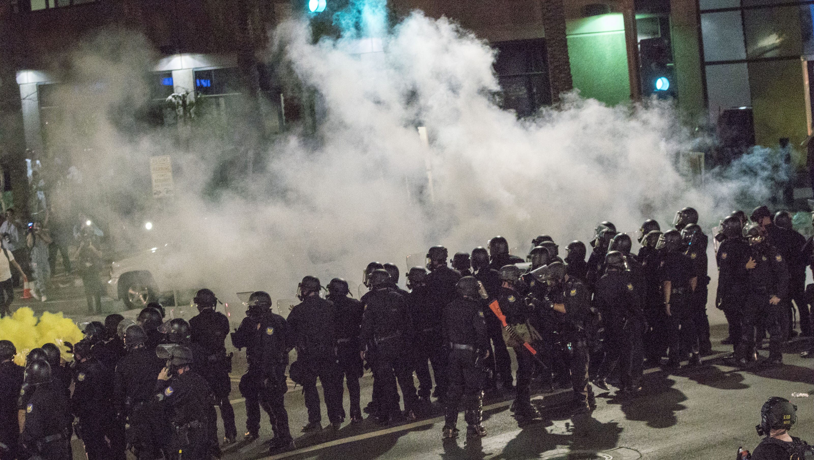 Police disperse Trump protest crowd with tear gas at rally in Phoenix