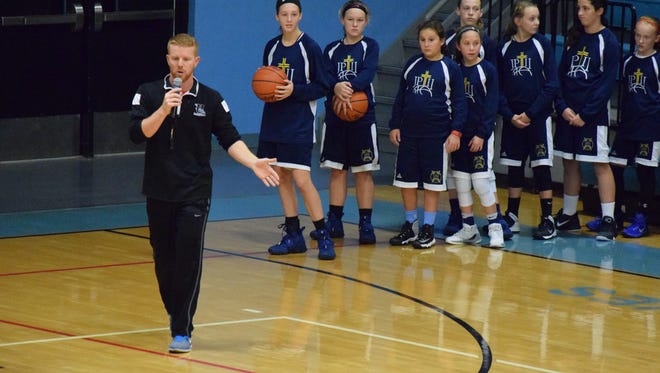 UCHS Bravettes Basketball coach Derek Phillips instructs the girls on their next drill.