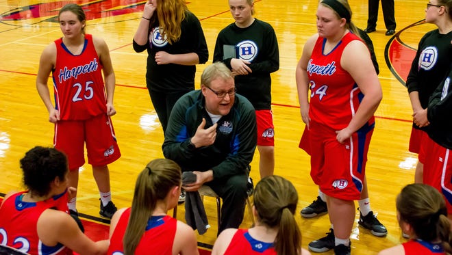 Harpeth girls basketball coach Jimmy Mitchell talks to his team.