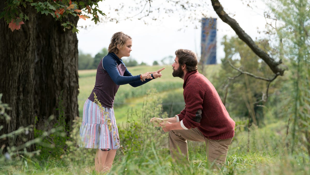 Millicent Simmonds, left, plays Regan Abbott and John Krasinski plays her dad Lee in "A Quiet Place."