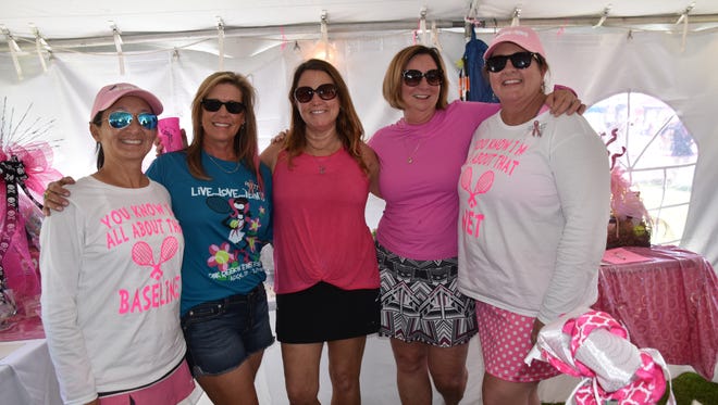 Tournament founder Lori Perkins (far right) with fellow directors of the Pink Ribbon Tennis Tournament, which celebrates its 16th year this weekend. Next to Perkins, Suzi Emerson, Gretchen Miller, Prebble Baker, Debbie Cook.