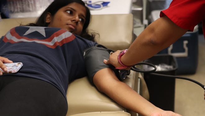 Shourya Kothakapu gives blood at the American Red Cross on June 11, 2018.