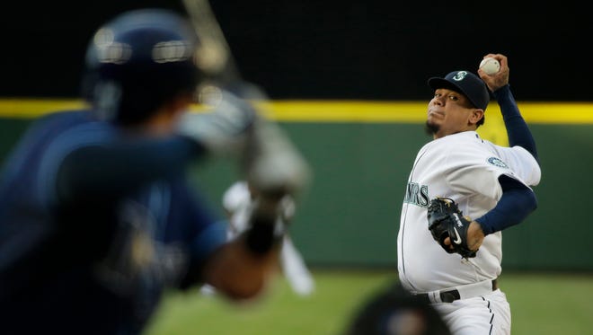 Seattle Mariners starting pitcher Felix Hernandez throws against the Tampa Bay Rays in the third inning of a baseball game, Saturday, June 6, 2015, in Seattle.