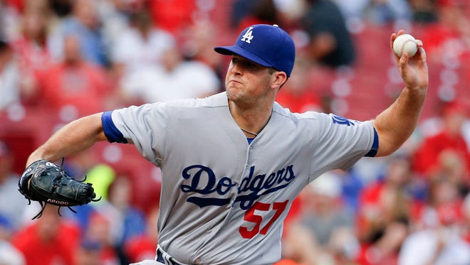 Alex Wood throws during the first inning.
