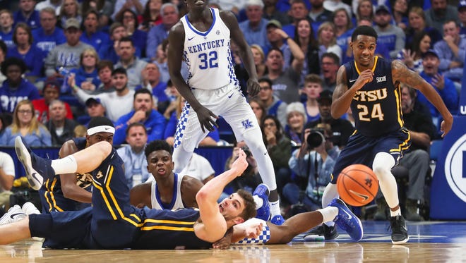 Kentucky's Hamidou Diallo tussled for a loose ball in the second half against East Tennessee State Friday night at Rupp Arena. The Wildcats won 78-61 after a sluggish start early in the first half. Diallo finished with seven points.