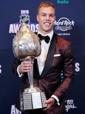 Taylor Hall of the New Jersey Devils poses with the Hart Trophy after winning the trophy at the NHL Awards, Wednesday, June 20, 2018, in Las Vegas.