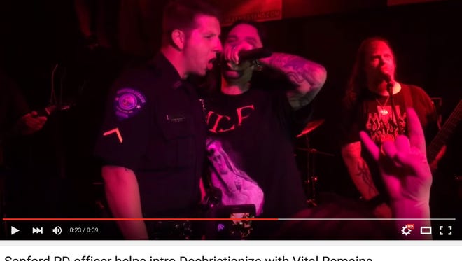 Former Sanford Police Officer Andrew Ricks attended a Vital Remains concert at a bar in Sanford, Fla., on Nov. 13, WFTV reported. While in uniform, Ricks got on stage and helped introduce the band and remained there to help sing the band’s song “Dechristianize” which includes lyrics like “let the killing begin.”
