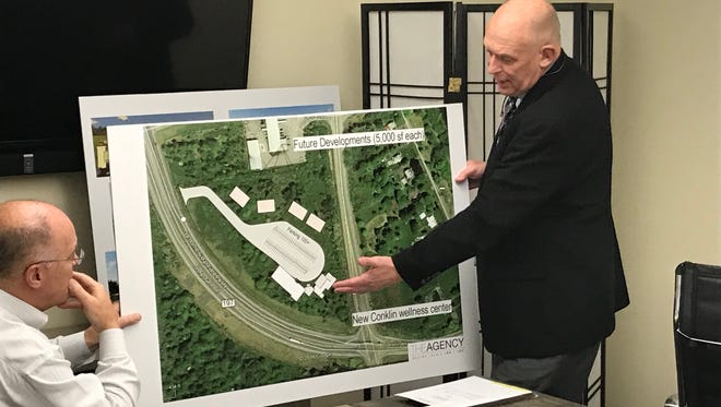 Kevin McLaughlin, right, executive director of the Broome County Development Agency, explains the Conklin community center project of board members at a meeting on Sept. 20, 2017.
