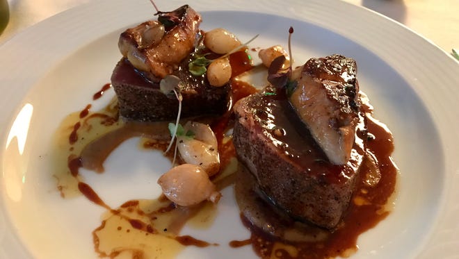 Sails' tuna Rossini features rare ahi topped with seared foie gras in a truffle sauce.