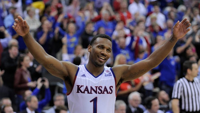 Wayne Selden Jr. of the Kansas Jayhawks celebrates after Kansas won the Big 12 Basketball Tournament in a 81-71 win over the West Virginia Mountaineers at Sprint Center on March 12, 2016 in Kansas City, Missouri.