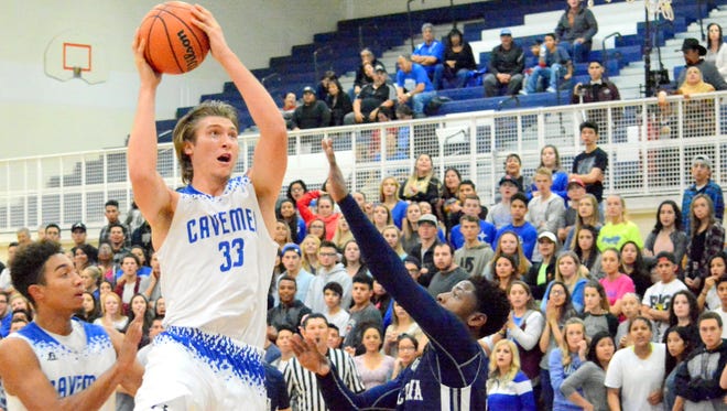 Carlsbad's Brenden Boatwright attacks the basket in the first quarter Friday.