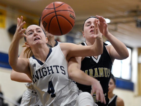 Old Tappan's Jackie Kelly #4 grabs a rebound in front