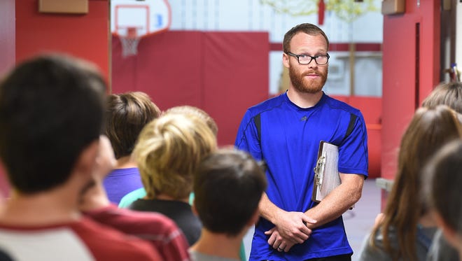 Colin Faherty teaches a fifth-grade physical education class at Bauder Elementary School in Fort Collins on Wednesday.  Faherty taught for several years in Fort Worth, Texas, and this is his first year in the Poudre School District.