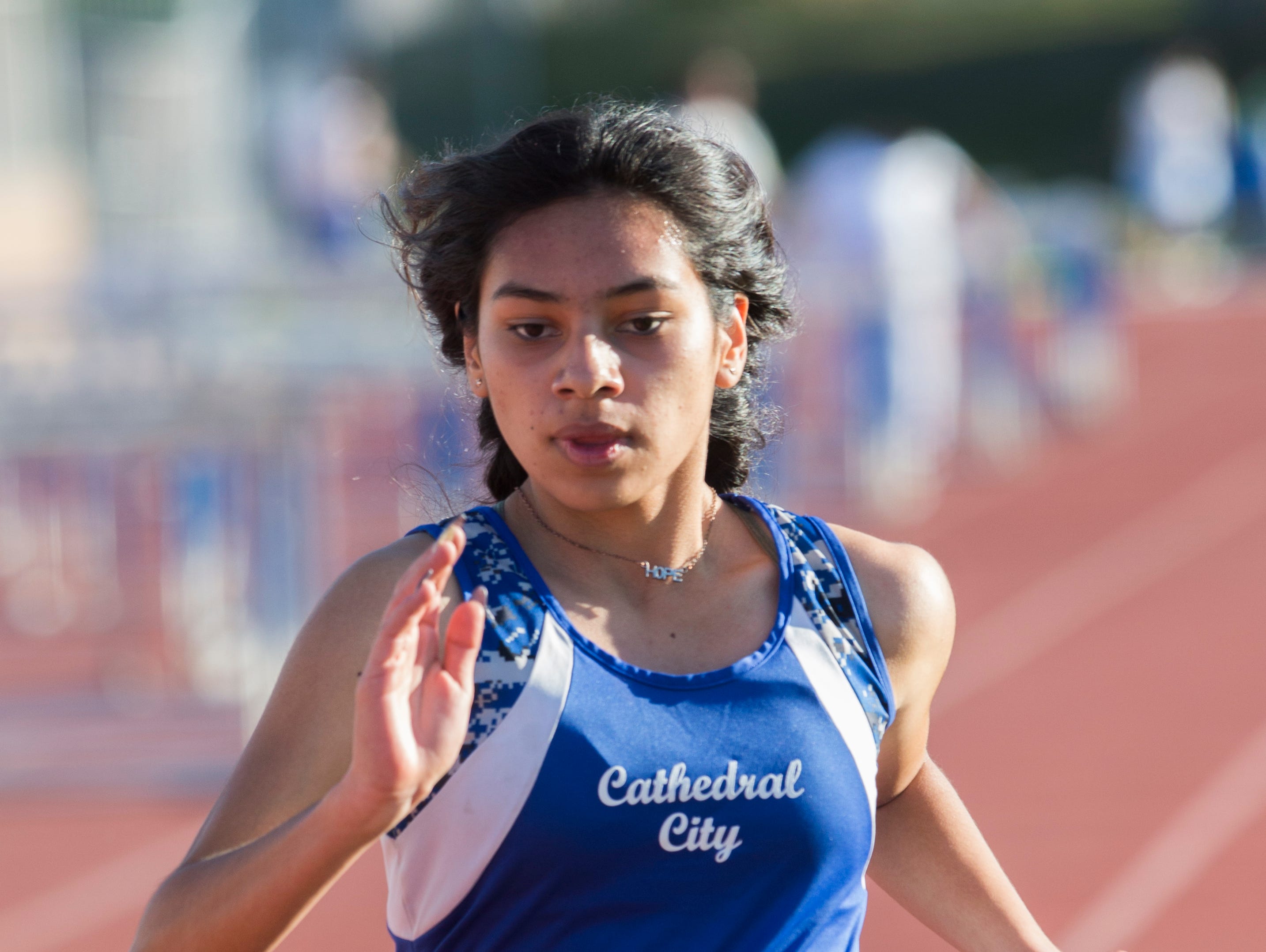 Cathedral City High School's Stephany Ramirez-Lopez finishes first in the 1600 meter race during her school's track meet at home against Desert Mirage High School and Desert Hot Springs High School.