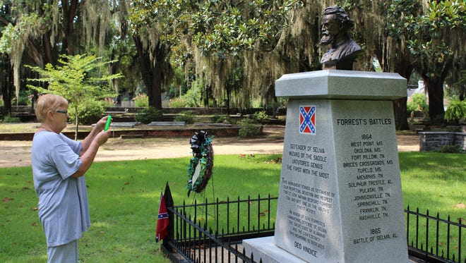 Tourist takes a photo of the Nathan Bedford Forrest monument at Live Oak Cemetery in Selma in this file photo.Some cities, including New Orleans, have begun to remove stone monuments to the Confederacy. Sen. Gerald Allen says his bill is not about Confederate monuments, made changes to the bill that create a permanent legislative committee to oversee state monuments and allow the Historical Commission to charge fees for its work. The process of removal remains in place.