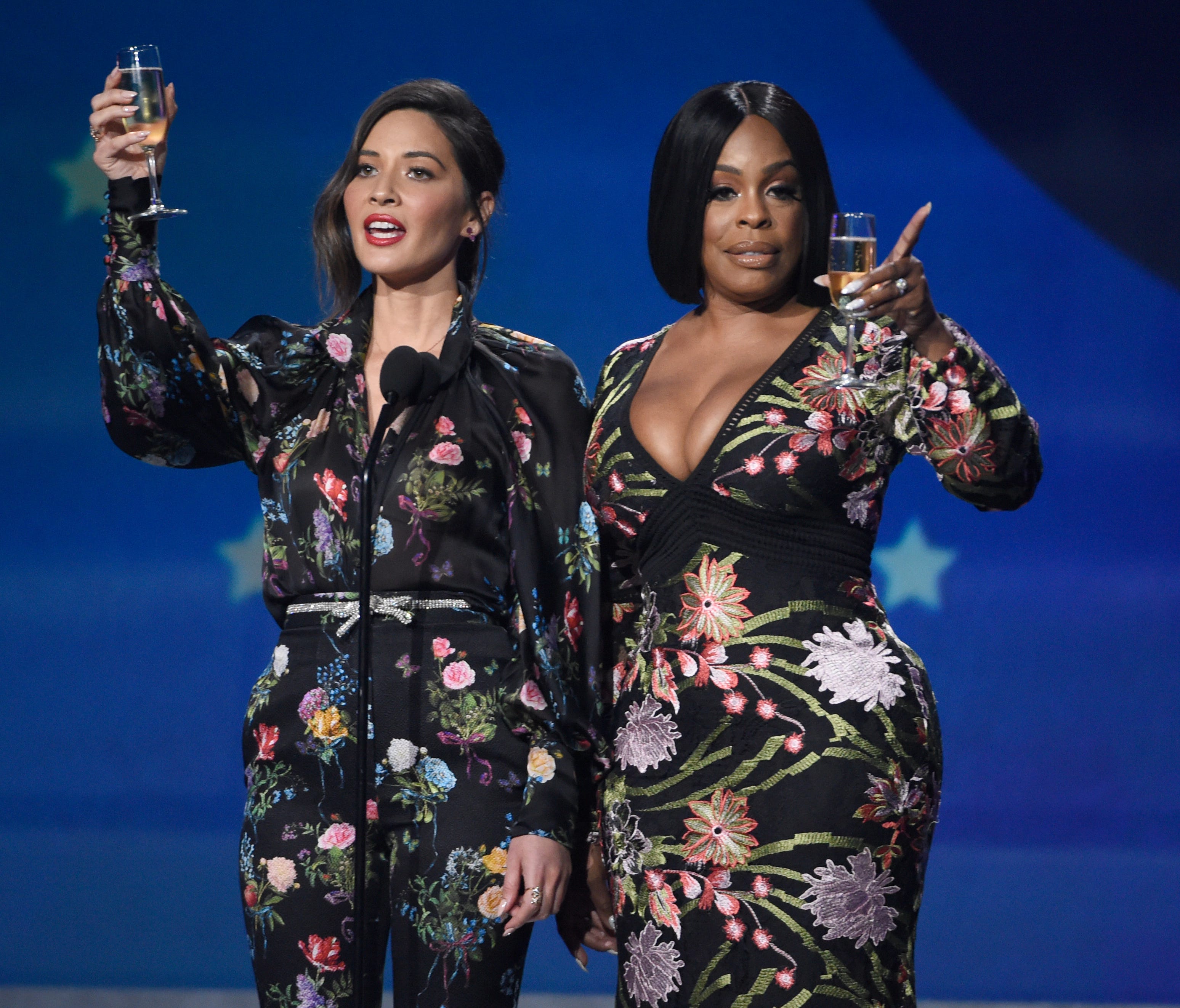 Host Olivia Munn, left, and Niecy Nash toasted the 
