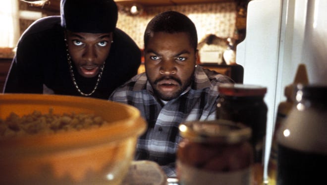 Chris Tucker, left, and Ice Cube struggle to repay their pot dealer in 1995's "Friday."
