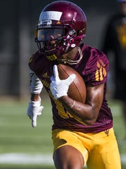 ASU WR John Humphrey runs after a catch during practice,