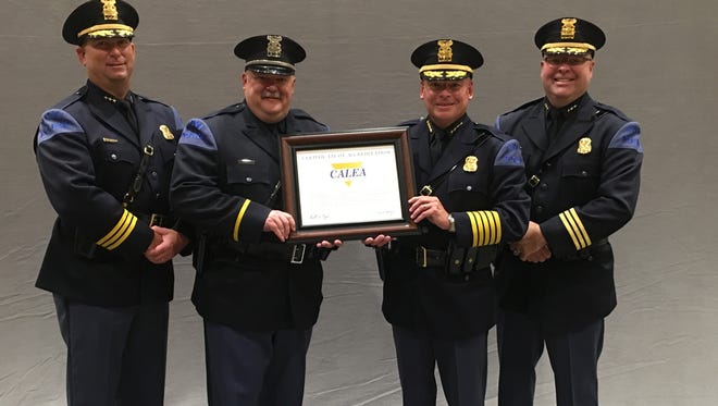 The Novi Police Department achieved the gold standard in law enforcement accreditation today from the Commission on Accreditation for Law Enforcement Agencies. Accepting it are (from left) Assistant Chief of Police Erick Zinser, Sergeant Kevin Rhea, Director of Public Safety/Chief of Police David Molloy and Assistant Chief of Police Jerrod Hart.