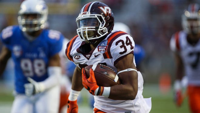Virginia Tech Hokies running back Travon McMillian (34) scores a touchdown during the first quarter against the Tulsa Golden Hurricane at Independence Stadium.
