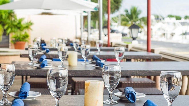 The outdoor patio behind the new FireFin Grill overlooks the Soverel Harbor Marina in Palm Beach Gardens.