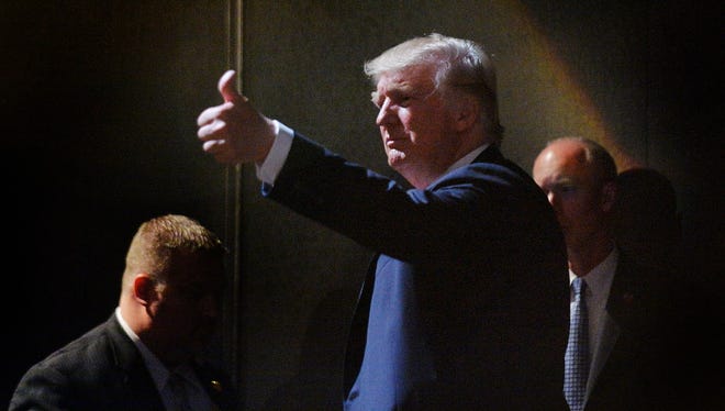 Donald Trump motions to the crowd while leaving the stage after a campaign event in Raleigh, North Carolina.