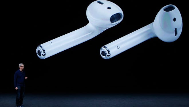 Apple CEO Tim Cook spoke during the Apple launch event at the Bill Graham Civic Auditorium in San Francisco on Wednesday. Cook unveiled new wireless ear buds.
