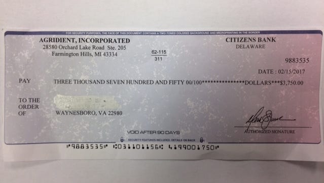 Pictured is a "check" that will actually allow scammers to access one's bank account, police said.