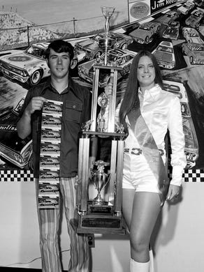 Darrell Waltrip, left, and Miss Sterling Edge Debbie