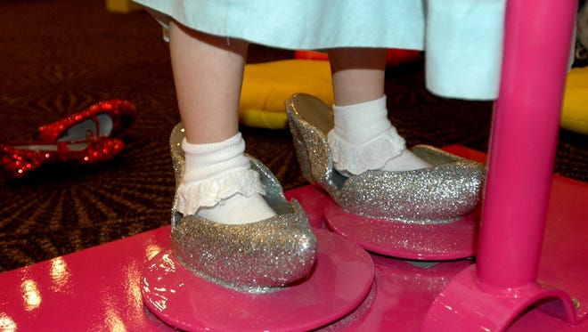 The Upcountry History Museum's "The Wonderful Wizard of Oz" exhibit gives museum-goers the chance to try on Dorothy's silver slippers.