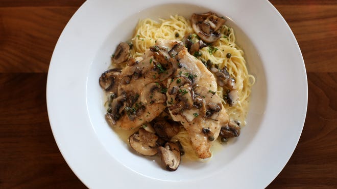
Chicken picatta at Deyo’s Italian Bistro in Maineville is sauteed with a lemon-caper butter sauce and mushrooms, and served over capellini.
