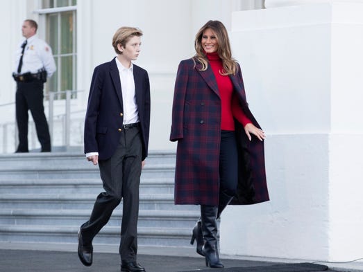 First lady Melania Trump and son Barron chat as they