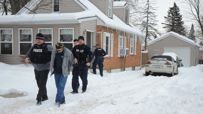 Police take Micheal Mileski from his house Tuesday, Feb. 13, 2018. He was arraigned on rape charges Thursday.