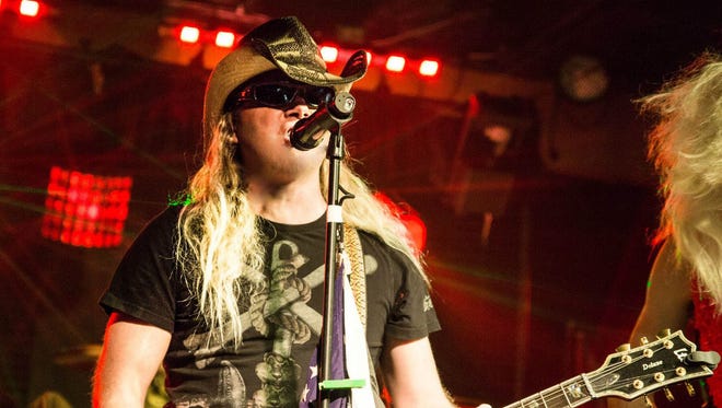 Will Barnes plays the role of lead singer Bret Michaels in Poison tribute band Poison'us.