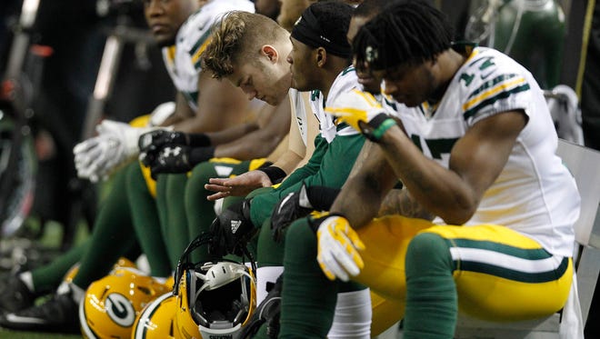 The Packer bench is quiet in the final minutes during the Green Bay Packers 44-21 loss to the Atlanta Falcons in the  NFC Championship game Sunday, January 22, 2016 at the Georgia Dome.
