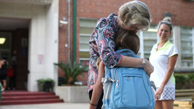 Kate Sullivan Elementary School Principal Pamela Stephen hugs fourth grader Macy Coombs outside of the school on the first day of classes for Leon County. Stephens is set to retire this December. “It’s bittersweet,” said Stephens. “It’s my 33rd year here at Kate Sullivan so I’ve seen many first days. It is a little emotional knowing that this is the last day I greet the kids on the first day of school. But it’s an awesome school and I know it will continue to do great things in the future.”