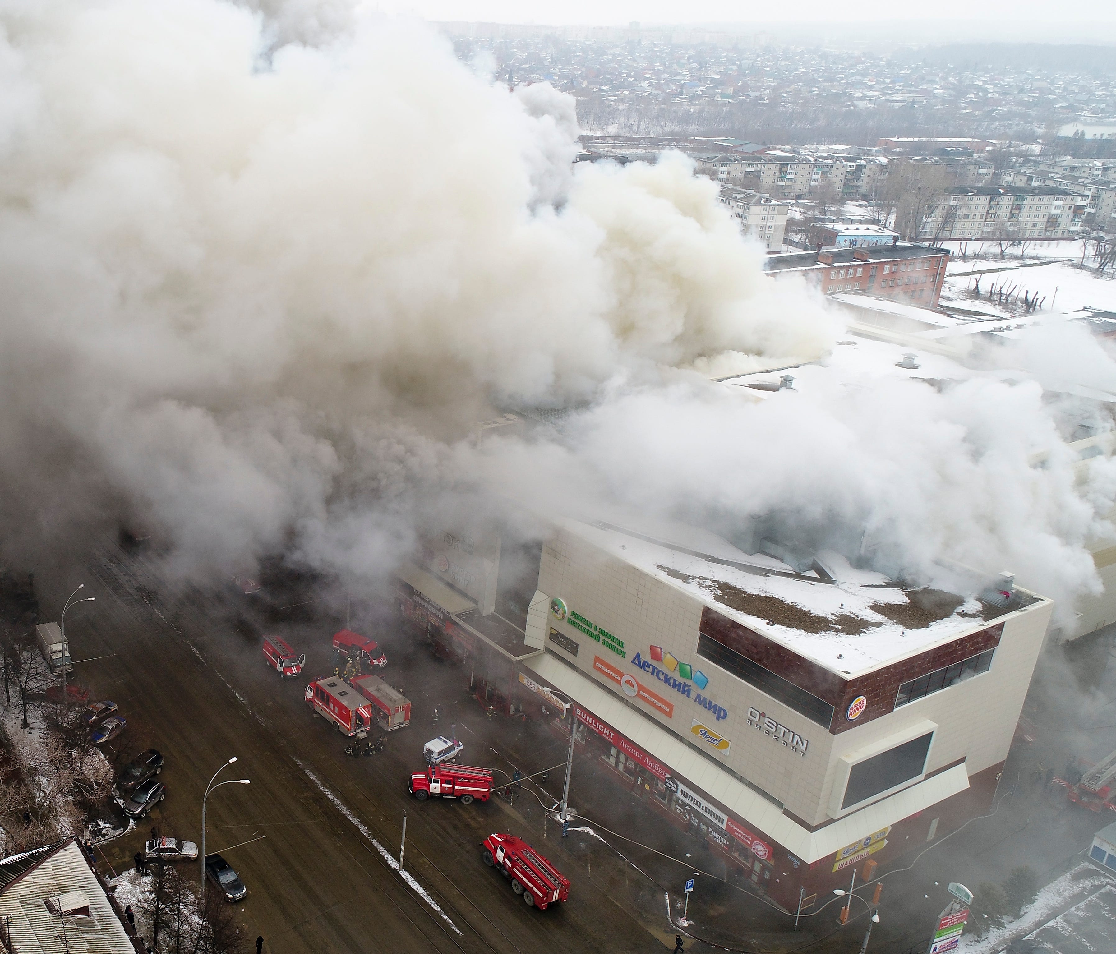 In this Russian Emergency Situations Ministry photo, on March 25, 2018, smoke rises above a multi-story shopping center in the Siberian city of Kemerovo, about 1,900 miles east of Moscow.