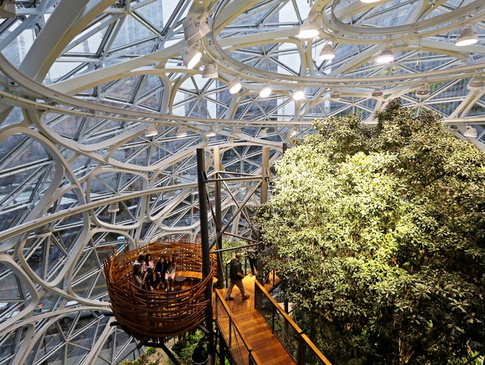 Guests sit in an area of the Amazon Spheres known as