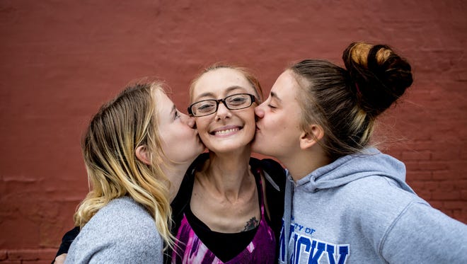 Michelle Redden, 33, gets kisses from her daughters Raelynn, 11, and Skylar, 13. Michelle was previously in partial remission from cervical cancer, but received a terminal diagnosis in August. We talk about it a lot and we sing, Skylar said. It didnt seem real at first, said Raelynn. It still doesnt seem real.