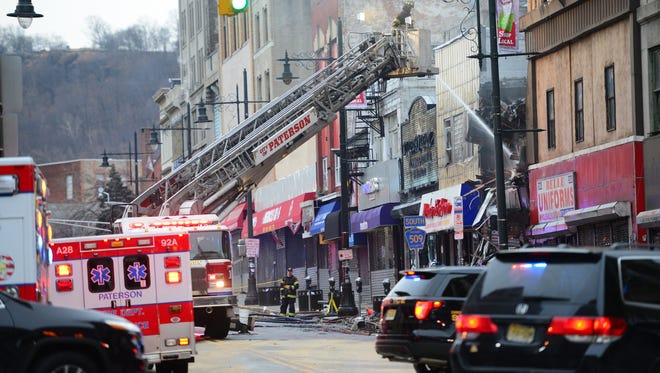 Paterson firefighters are still pouring water on a 5th Alarm fire on Main Street Tuesday morning, February 06, 2018. Main Street in closed to all traffic from Ward St to Market St.