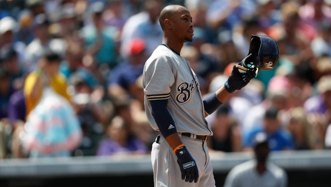 Keon Broxton takes his helmet off after striking out with runners on the corners to end an inning against the Rockies last Sunday. For the season, the Brewers were batting .235 with runners in scoring position, ranking 26th among the 30 big-league clubs.