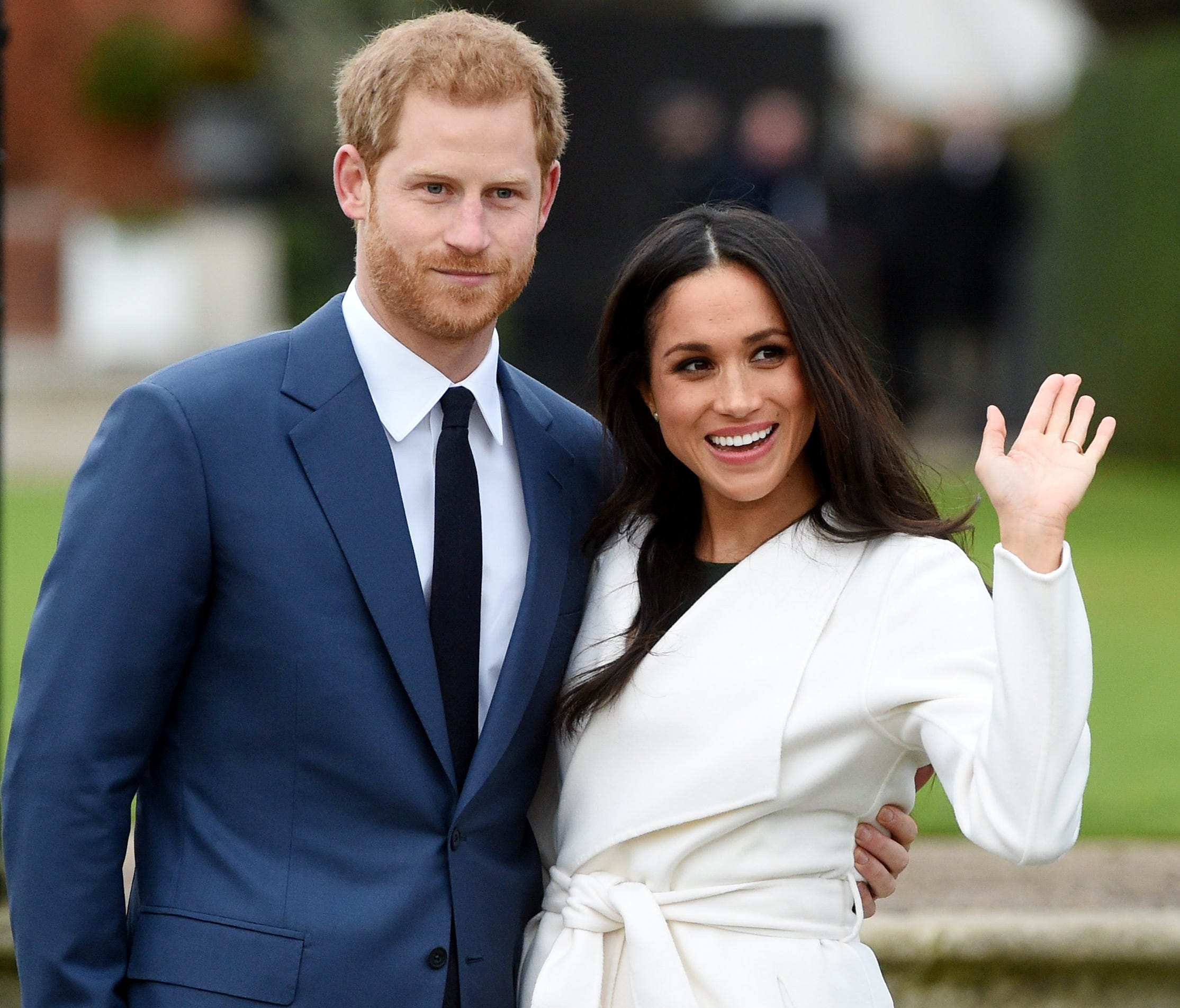 Britain's Prince Harry pose with Meghan Markle during a photocall after announcing their engagement in the Sunken Garden in Kensington Palace in London.