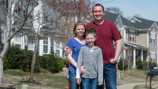 Jennifer and Travis Toy with their daughter Adrianna in the Old Hickory Commons subdivision in Nashville. The neighborhood where the Toys bought their home eight years ago is expanding.