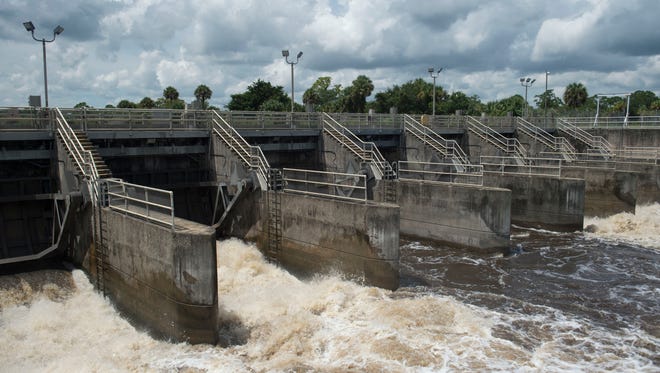 Water from Lake Okeechobee is discharged through the St. Lucie Lock and Dam on Wednesday, Sept. 6, 2017, in Stuart. About 1.1 billion gallons of water was released Sept. 6 with discharges ending Saturday, Sept. 9, before the arrival of Hurricane Irma, according to the Army Corps of Engineers. Discharges started again Friday, Sept. 15, after Irma came through the state.