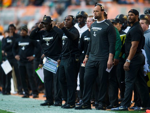 Vanderbilt coaching staff stand on the sidelines during