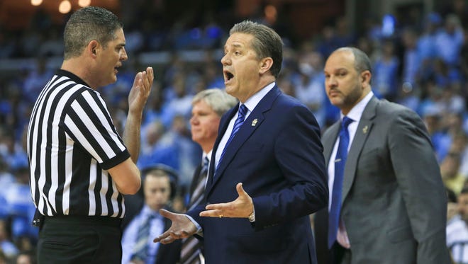 Kentucky coach John Calipari complains to a referee about the officiating during the game against North Carolina in the Elite Eight game at Memphis.