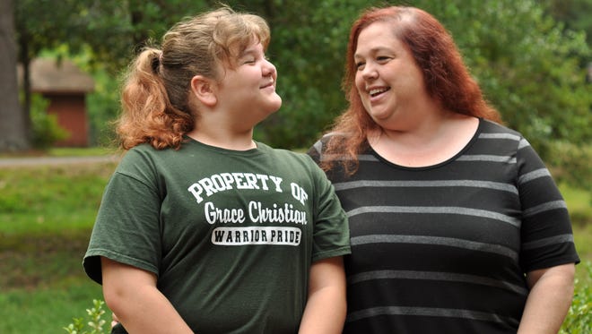 Stephanie Riley (right) moved her fifth-grader Kate (left) and eight-grader Tony from Phoenix Magnet Elementary School to Grace Christian School last fall.